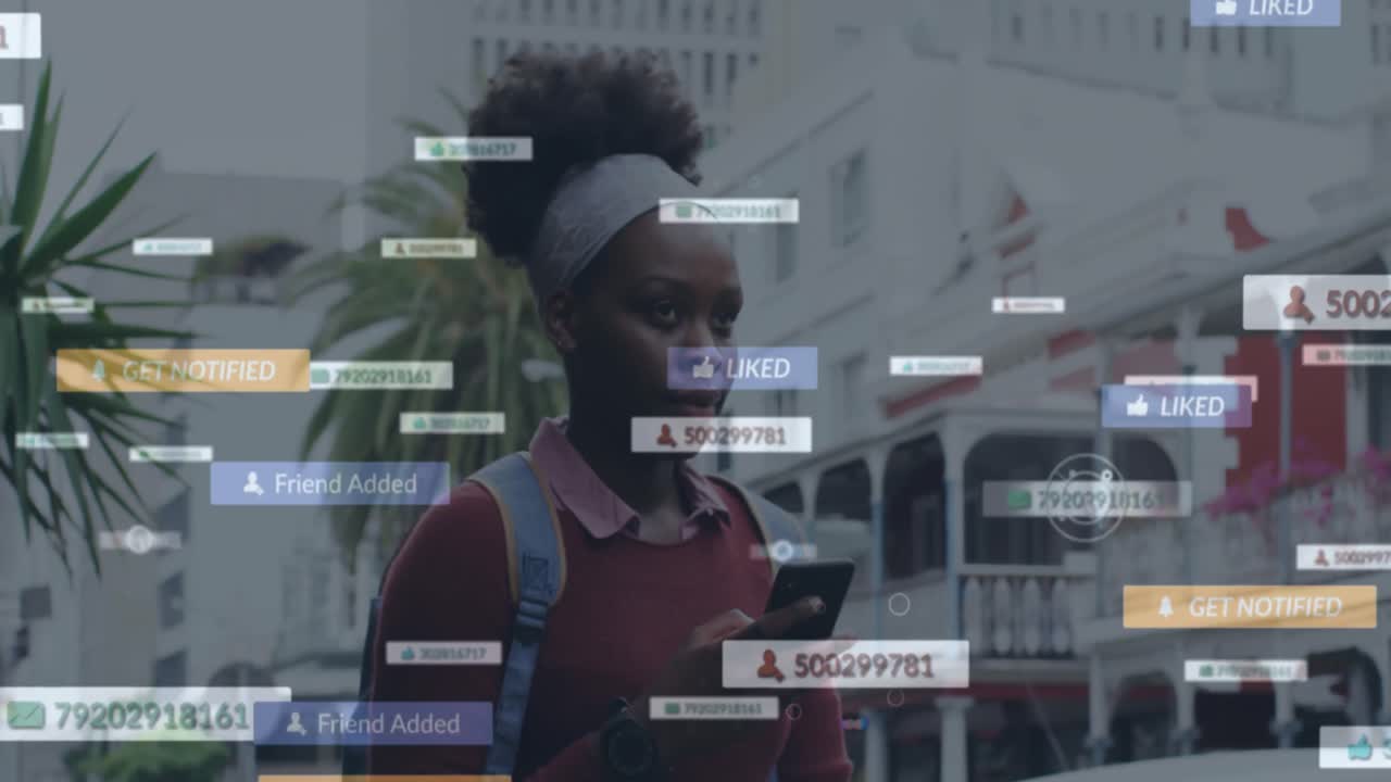Animation of social media notifications over african american woman using smartphone in city street