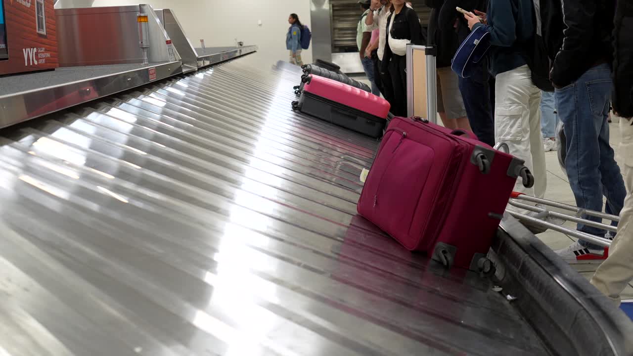 Suitcases on a Baggage Carousel at an Airport