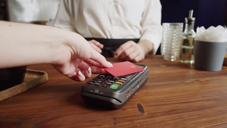 paying with credit bank card in cafe. touch-free and contactless food shopping in restaurant. nfc technology concept.