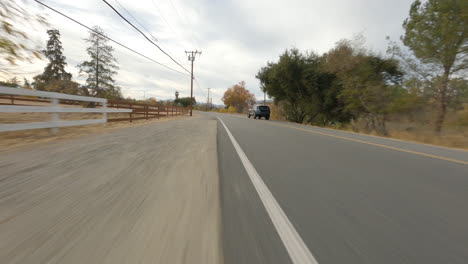 low fpv tracking shot of a police suv traveling whilst out on duty