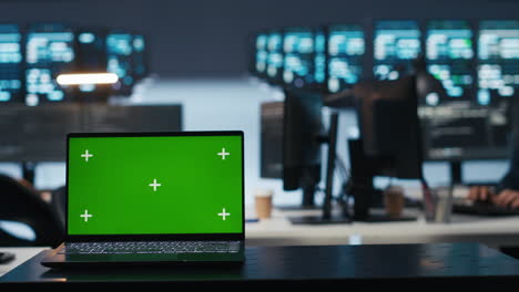 close up shot of chroma key notebook and it expert coding in data center