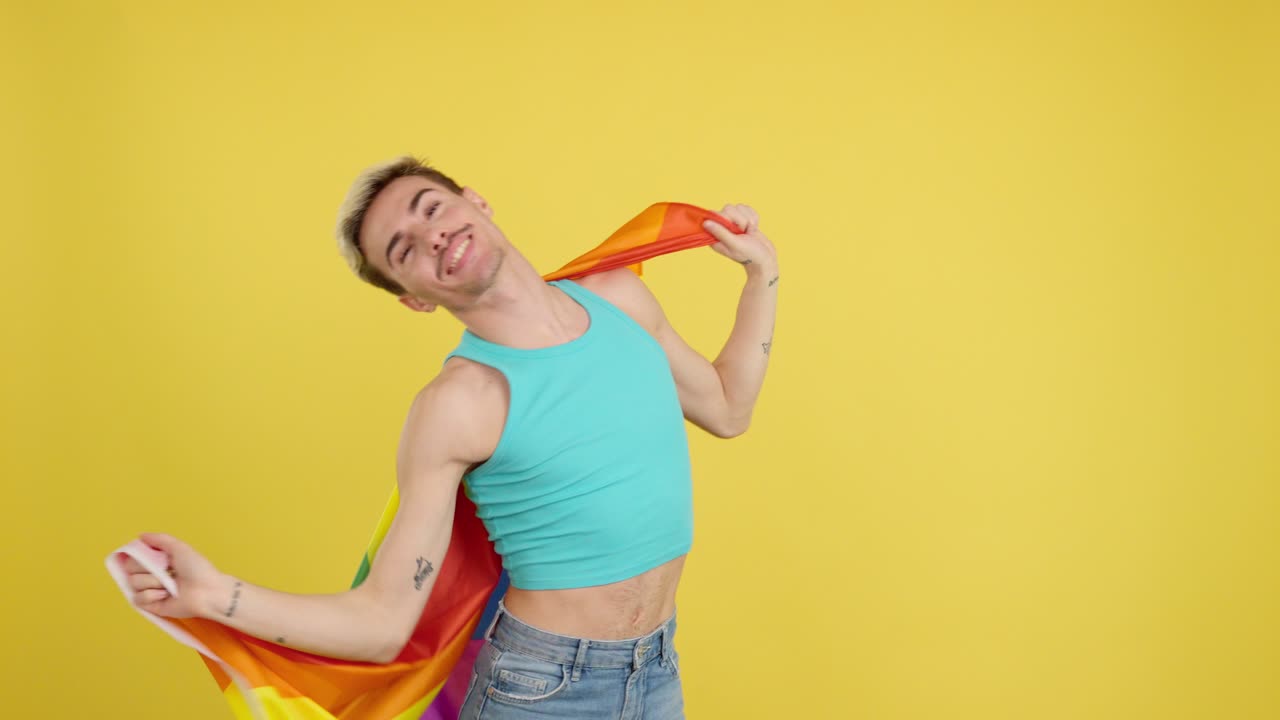 Man wrapped in rainbow flag