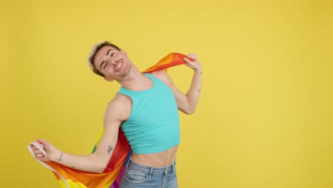 man wrapped in rainbow flag