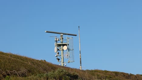 rotating weather radar on a hill