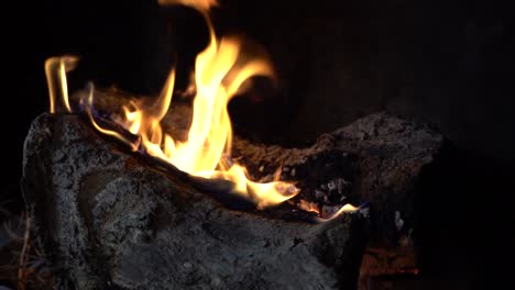 slow motion fireplace burning, panning right to left