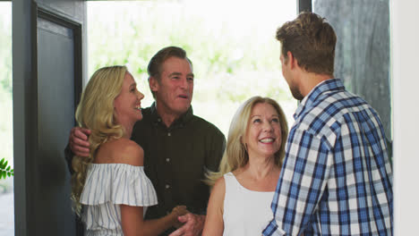 happy family hugging each other at home