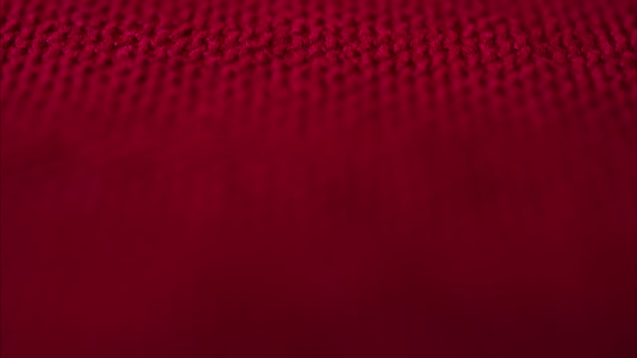 Close up of a red table cloth on a table at a restaurant