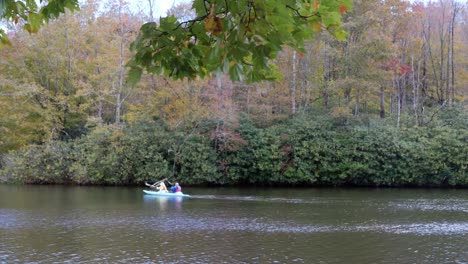 kayakers on price lake in fall near blowing rock nc