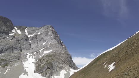 Mountain-to-hill-pan-on-sunny-day,-Rockies,-Kananaskis,-Alberta-Canada