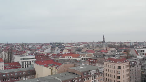 AERIAL:-Slow-flight-over-Empty-Berlin-Neighbourhood-with-Rooftops-during-Coronavirus-COVID-19-on-Overcast-Cloudy-Day