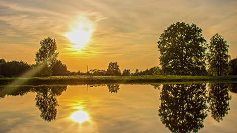 Perfect-Mirror-Reflection-On-Idyllic-Lake-At-Sunrise-Through-Sunset