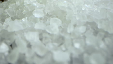 crystal coarse sea salt falling and masking the camera view