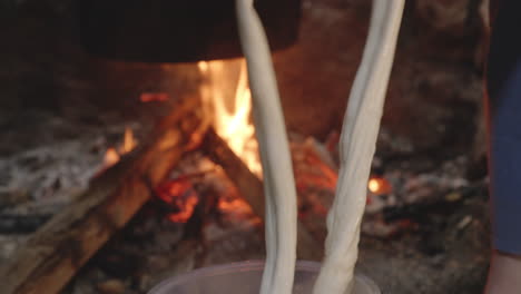 pouring water on cheese, processes cheese by hand, chobareti, georgia, close up