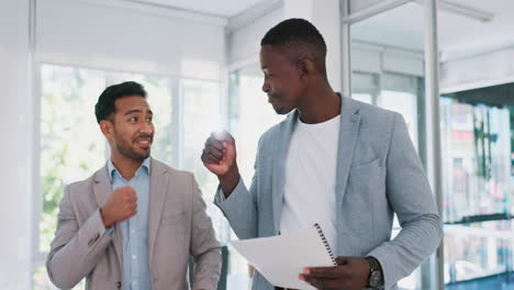 Fist-bump,-team-building-or-men-walking-in-office