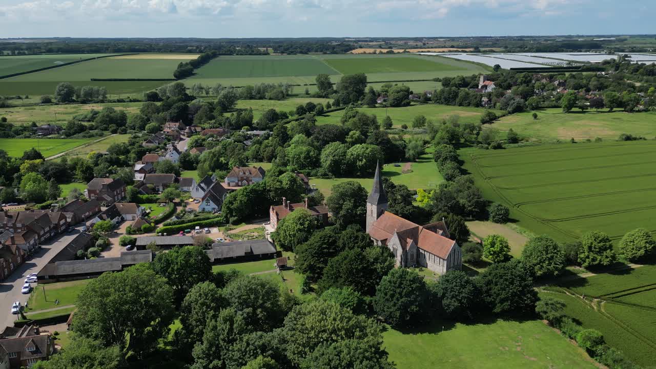 An easy arc shot of Ickham village, Kent, with St John the Evangelist church in the foreground