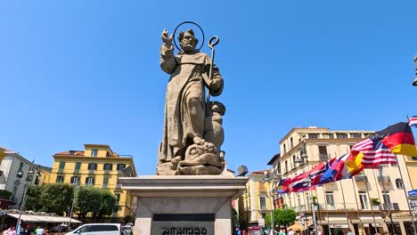 traffic and pedestrians around central statue