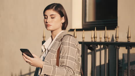 stylish woman making a business call outdoor.