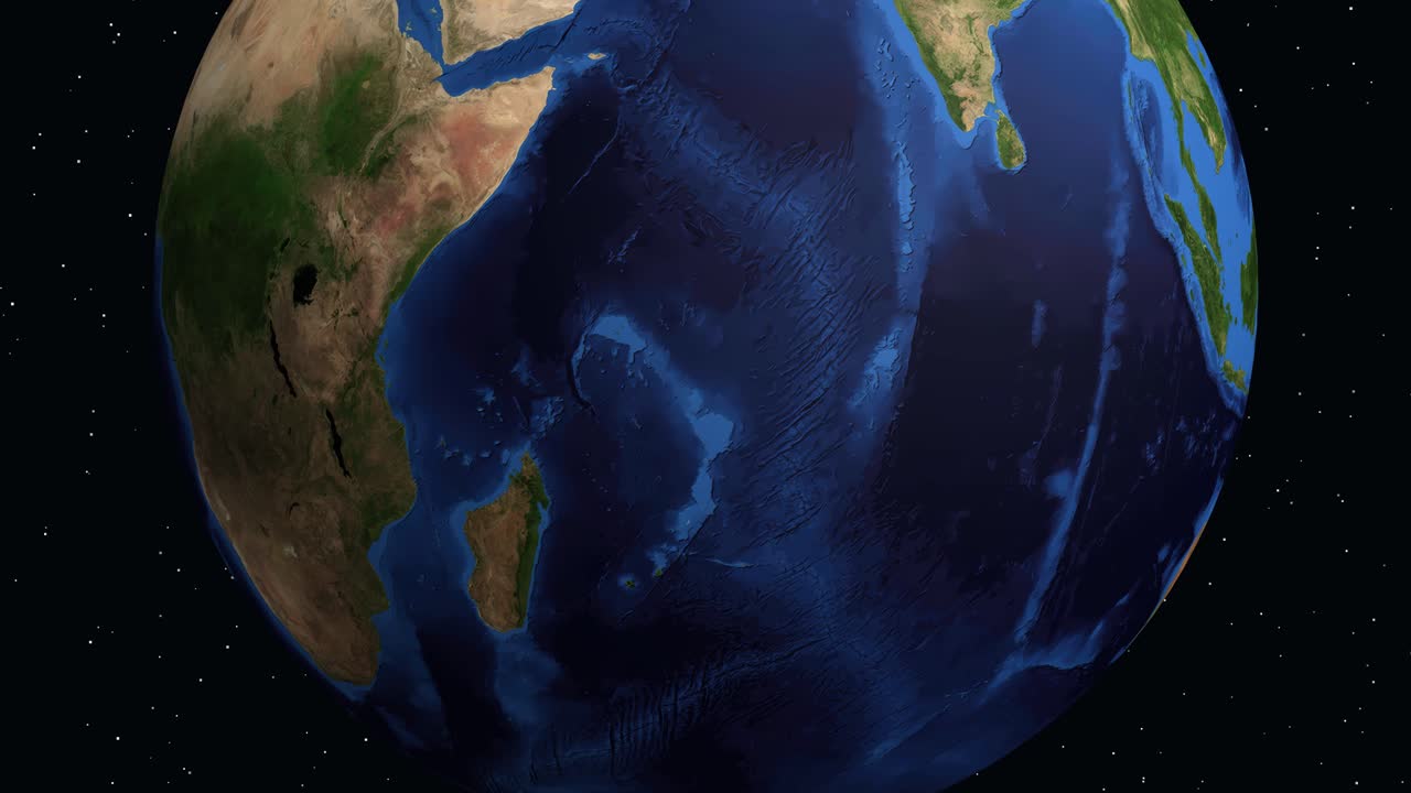 Digital globe rotates and zooms into East Africa, highlighting Moroni with a red pin