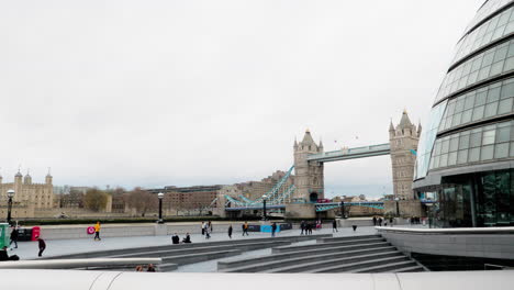 Pan-left-to-right-of-Tower-Bridge-with-people-walking-by