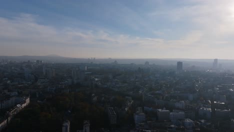 aerial flyover in the misty haze of the morning of the city of belgrade, serbia