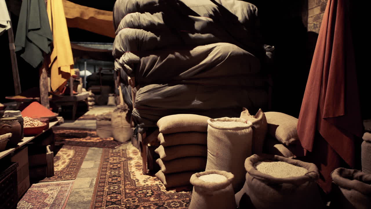 Old national african bazaar filled with colorful textiles and sack goods