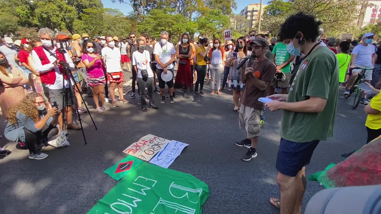 images of slogans lying on the floor on canvas and the masses of people at the protest against the murders of the brasilian indigenist bruno pereira and the british journalist dom phillips in amazon