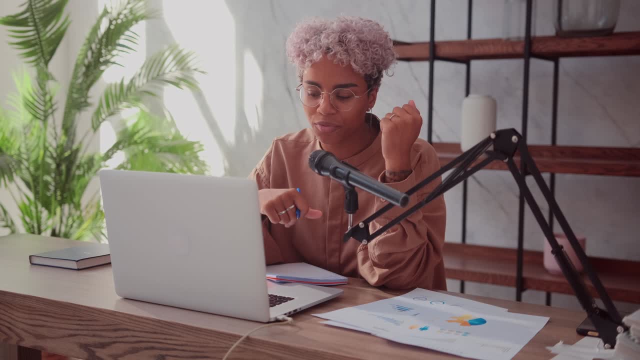 African woman distance teacher leads webinar class talks with student by webcam