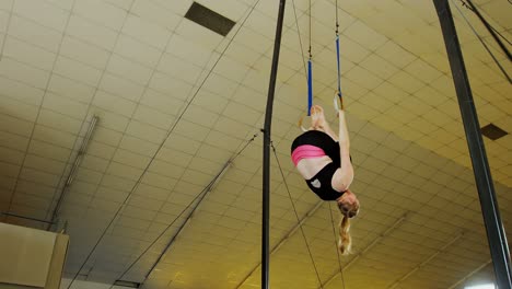 gymnast practicing with ring row