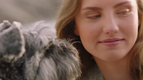 close up beautiful woman smiling playing with dog in park enjoying petting fluffy companion having fun relaxing on grass caressing puppy