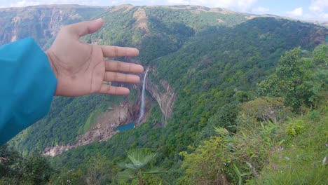 isolated-waterfall-falling-from-mountain-top-nestled-in-green-forests-from-top-angle-video-taken-at-Nohkalikai-waterfalls-cherrapunji-meghalaya-india