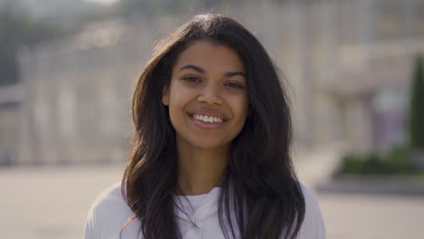 portrait of young pretty black woman smiling to camera