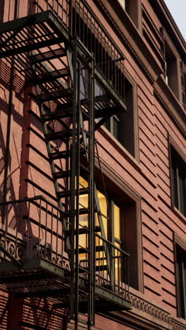 urban brick building with fire escape