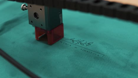 laser cutting through a canvas surface with precision