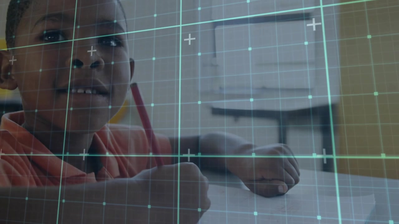 Smiling African American Boy Writing at Desk with Digital Grid Overlay