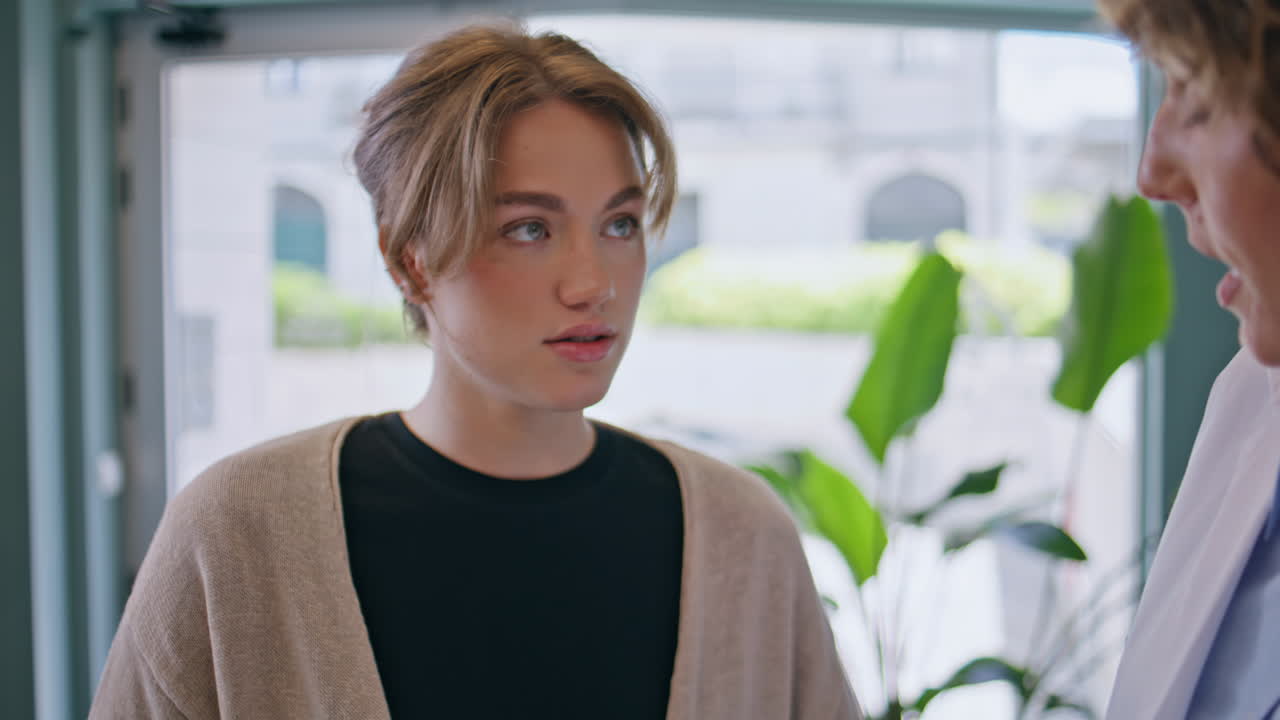 Girl patient talking doctor at medical consultation closeup. Physician showing