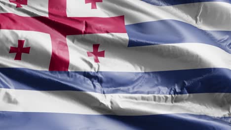 la bandera de ajaria se agita lentamente en el bucle del viento. la bandera adjariana se balancea suavemente en la brisa. el fondo de relleno completo. 20 segundos de bucle.