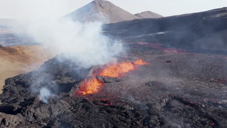 Active-fissure-spewing-extreme-hot-molten-lava-from-underground,-aerial