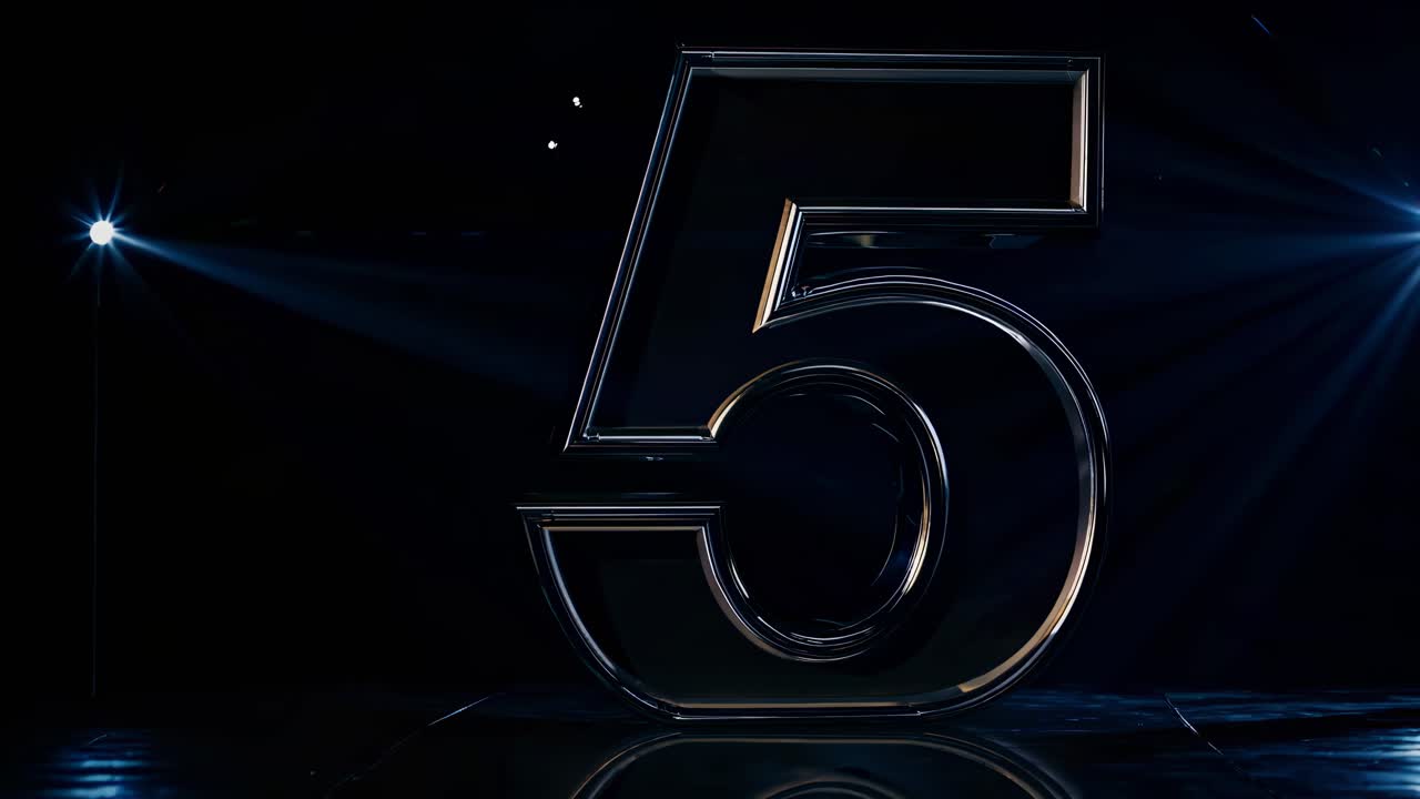 A dynamic video showcasing a metallic number 5 with dramatic lighting