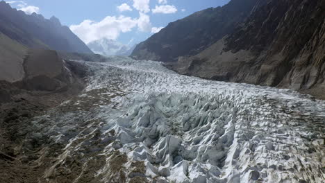 Wide-drone-shot-over-glacier-at-Fairy-Meadows-Pakistan,-cinematic-wide-rotating-aerial-shot