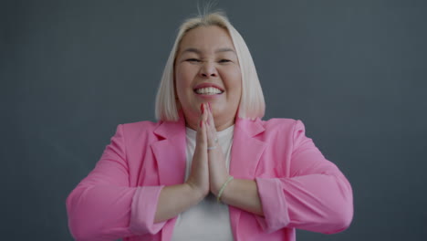 Woman in Pink Blazer Praying