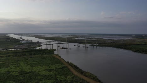 Twin-bridge-over-a-busy-shipping-channel-near-Bridge-City-Texas-during-a-sunset