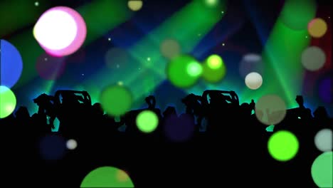 Moving-spots-of-coloured-light-and-crowd-silhouette