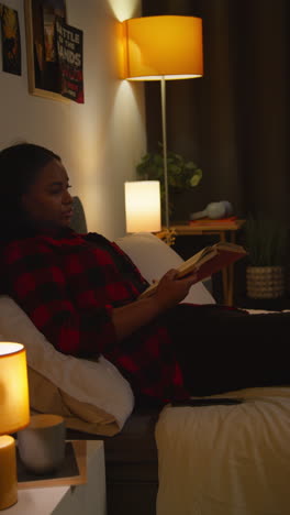 woman reading in bed at night