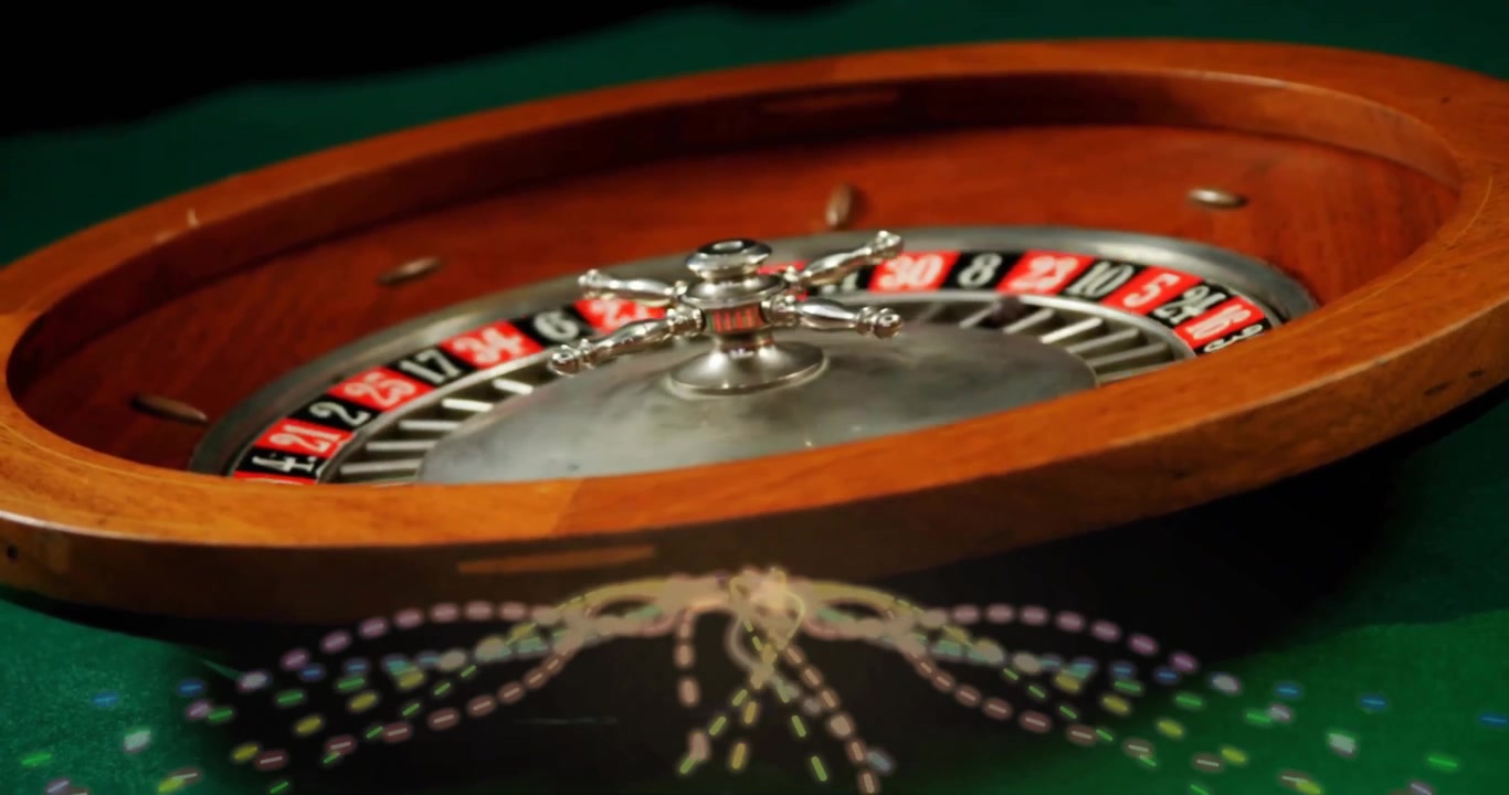 Close view starting roulette wheel spinning and white ball slowly rolling inward revealing result