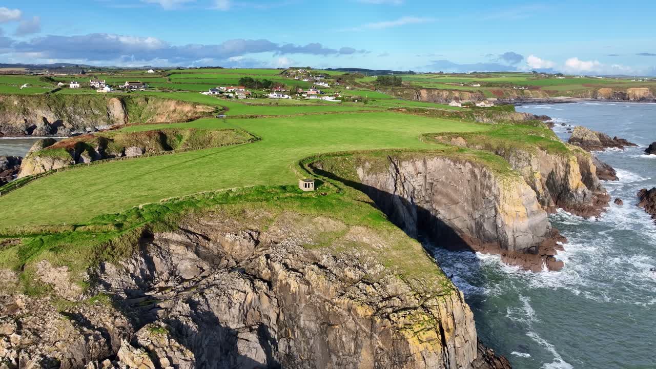 epic drone circling WW2 lookout hut on sea cliffs at Dunabrattin Head Copper Coast Waterford