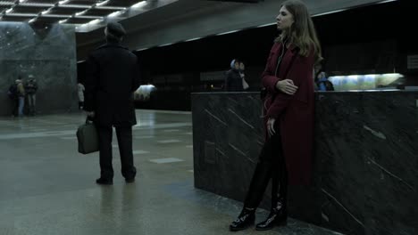 woman and man at a subway station