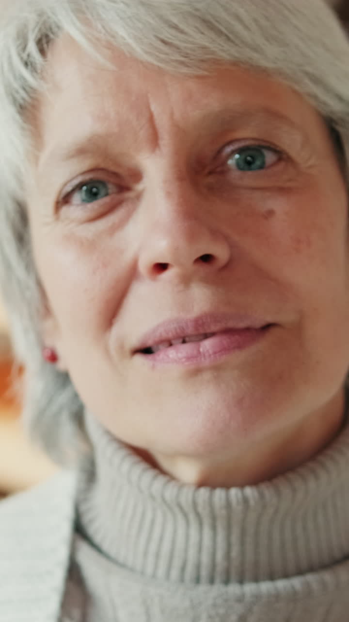 Vertical Close-up Portrait of a Senior Woman with Grey Hair