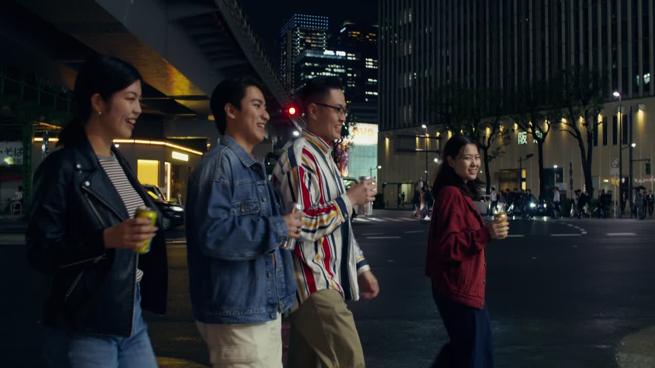 Friends Walking at Night in Japanese City