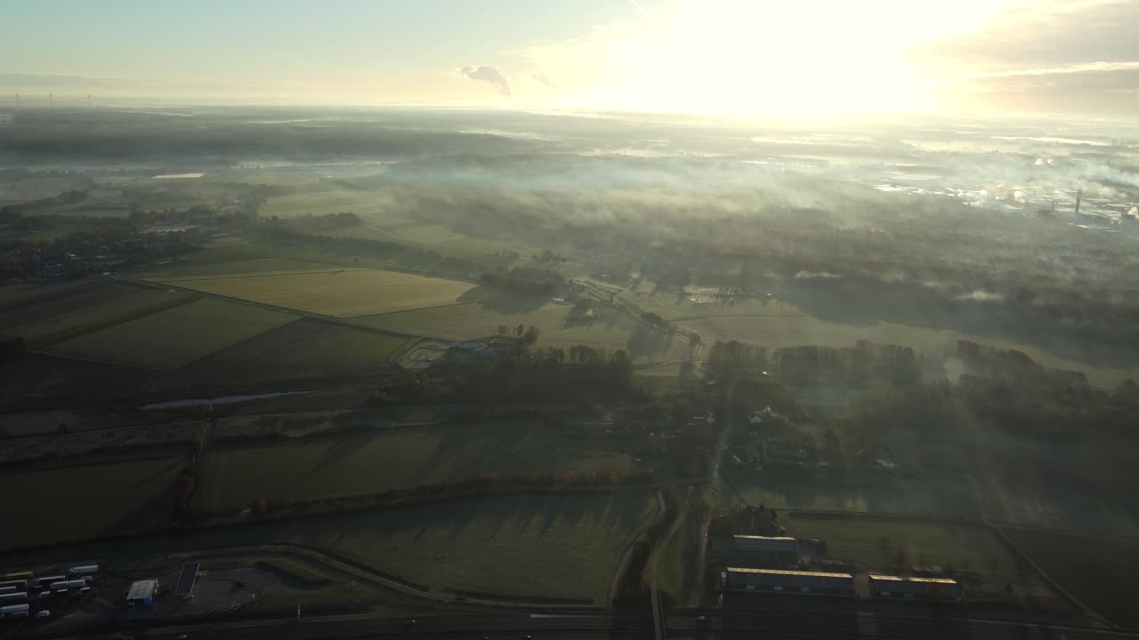 Aerial View of Foggy Landscape at Sunrise