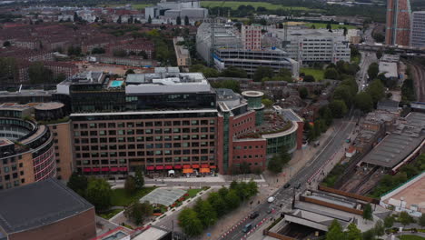 Aerial-view-of-modern-Television-centre-building.-Trains-standing-in-White-City-train-station.-London,-UK